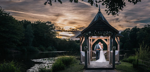 Bride and groom sharing a kiss during golden hour in East Sussex